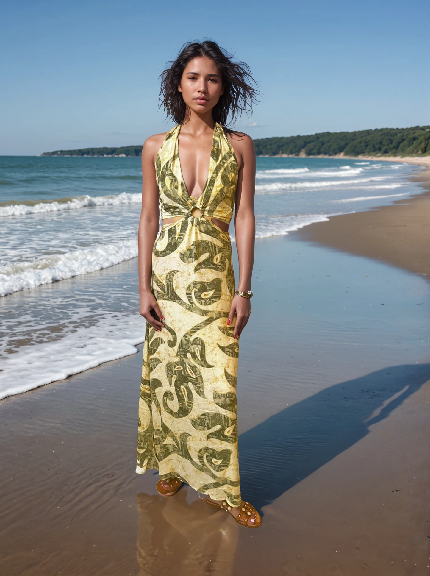 Model on the beach wearing halter maxi dress with open back and tropical print in green tones”
“Front view of yellow-green patterned halter dress with ring detail and deep V neckline on sandy beach”